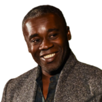 Thumbnail of Chris Ofili smiling and looking towards the right.